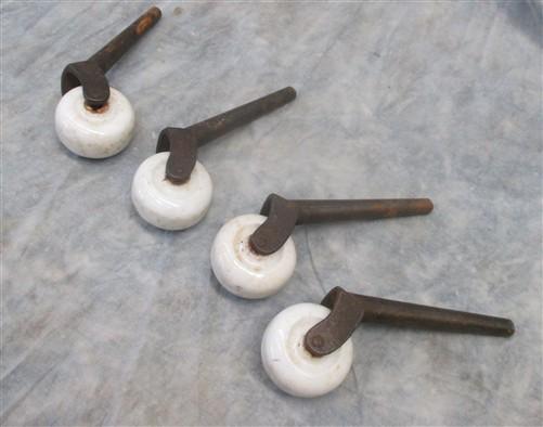 Casters - 4 Porcelain Caster Wheels Antique Furniture Roller Dresser Desk Industrial Age V by The Old Grainery